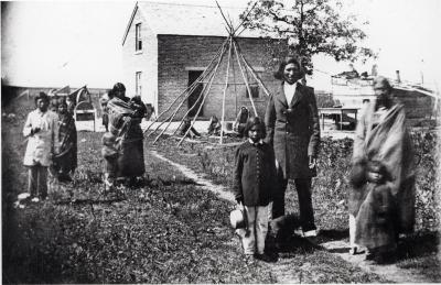 Robert Hopkins Chaska and family at Chaska's house near Dr. Thomas Williamson's Pajutazee mission near the Yellow Medicine Agency